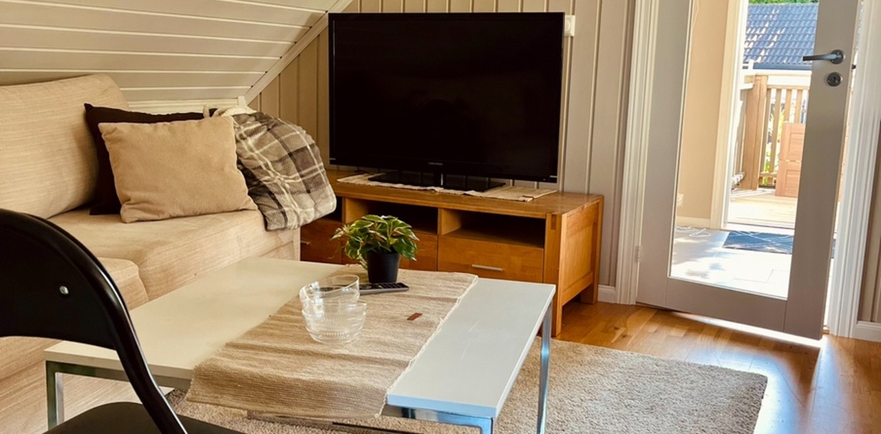 Sovesofa og TV - apple-tv medfølger