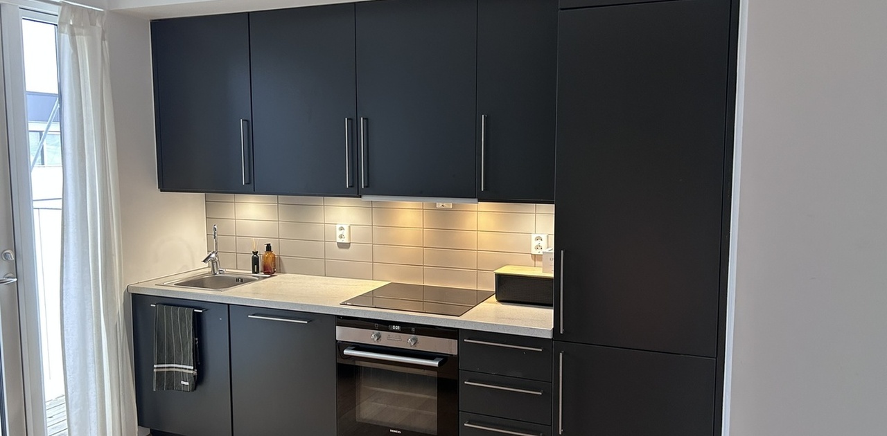 Kjøkkenløsning med integrerte hvitevarer